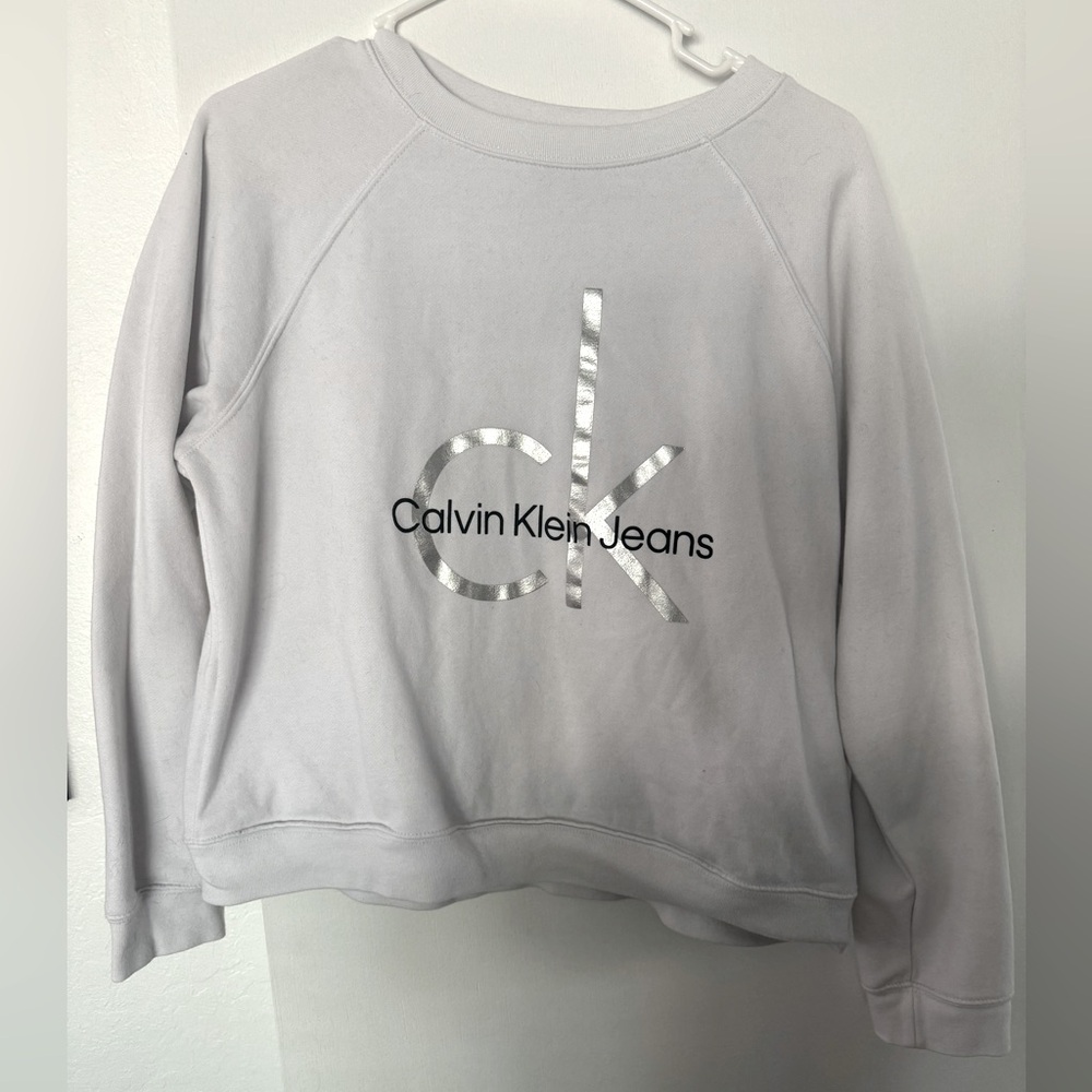White Calvin Klein pullover sweatshirt with metallic monogram no hood.